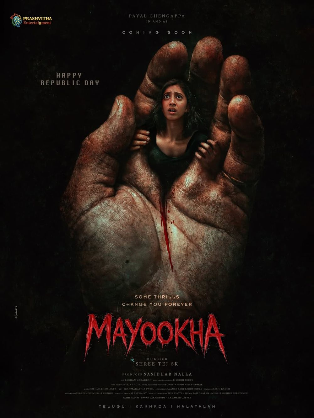 Mayookha film poster: a frightened young woman held inside a giant blood-stained hand